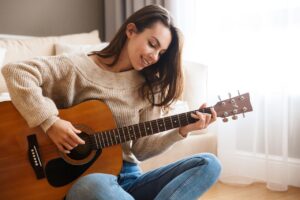 playing guitar in an Airbnb